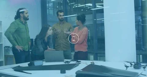 Smartphone icon image over diverse team collaborating in modern office Stock Photos