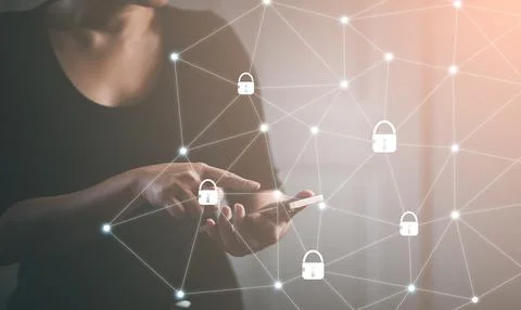Smartphone with icon security on the virtual display, woman touch technology  Stock Photos