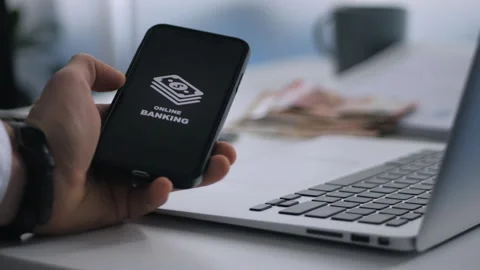 A smartphone with an image of online banking in a hand Stock Footage 268981197