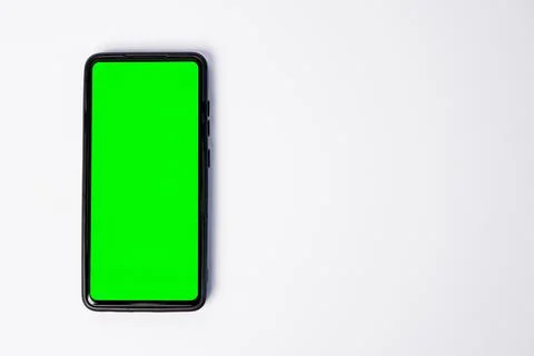 A smartphone key green screen placed vertically on the left side, leaving a.. Stock Photos