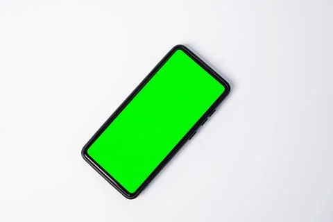 A smartphone key green screen placed diagonally on the left side, leaving a.. Stock Photos
