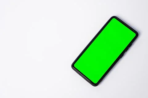 A smartphone key green screen placed diagonally on the right side, leaving .. Stock Photos