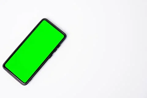 A smartphone key green screen placed diagonally on the left side, leaving a.. Stock Photos