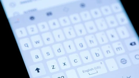 Smartphone Keyboard typing coronavirus on google search,web communication Stock Footage 126373142
