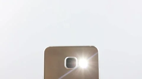 Smartphone LED.Flashlight turned on on the smartphone. Bright LED flashlight Stock Footage 202616880
