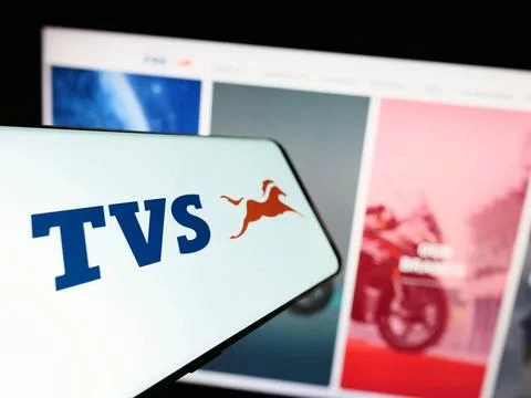  Smartphone with logo of motorcycle company TVS Motor Company Limited on s... Stock Photos