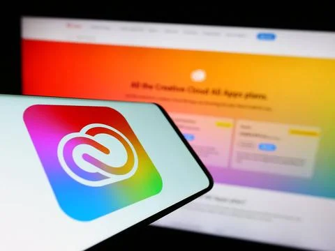 Smartphone with logo of software Adobe Creative Cloud on screen in front o... Foto stock