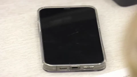 Smartphone lying on the table close-up Stock Footage 314963045