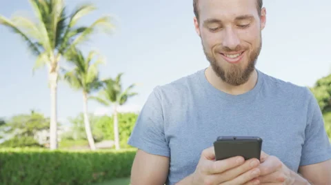 Smartphone man using mobile cell smart phone - casual using mobile cell phone Stock Footage 47346475