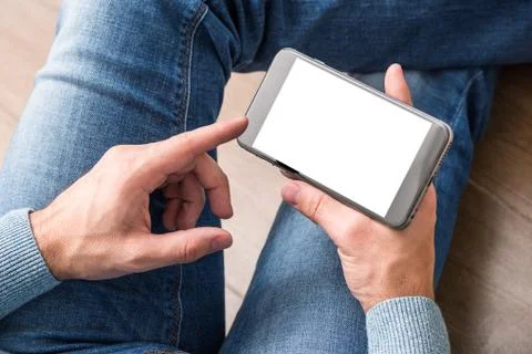 Smartphone in man's hands. Clipping path included 库存照片