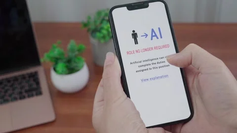 Smartphone Message Notifying Worker Their Job Role Is Replaced by AI Stock Footage 343972392