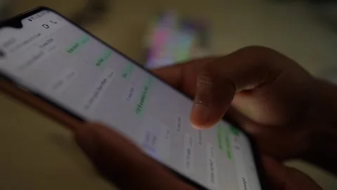 Smartphone message scrolling a persone by hand video footage Stock Footage 290951422