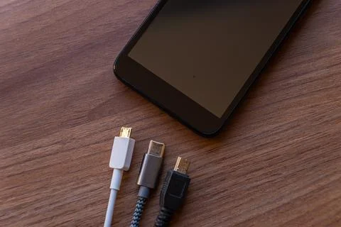 Smartphone with mini usb, micro usb, usb type c plugs Stock Photos