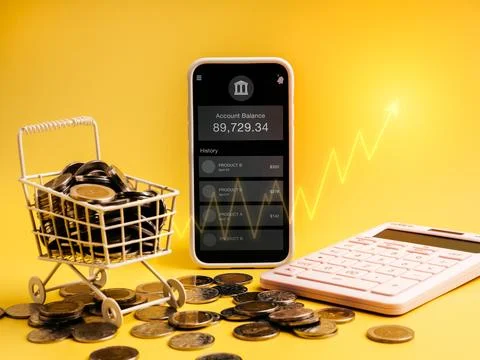 Smartphone mobile banking application with coins, calculator, shopping cart.. Stock Photos