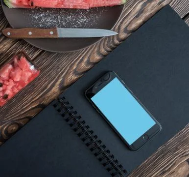 Smartphone mock-up on kitxhen table Stock Photos