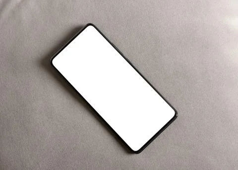 Smartphone mockup with blank screen on a neutral background. Angled mobile .. Foto stock