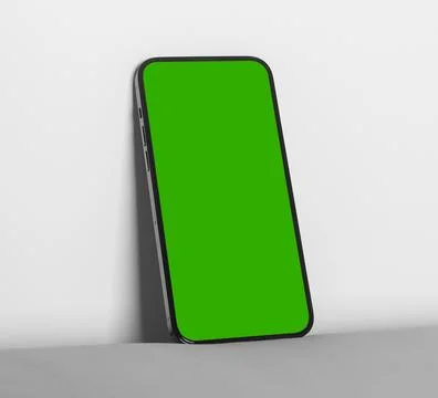 Smartphone mockup with green screen on a plain background. Leaning mobile pho Foto stock