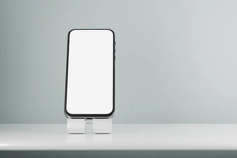 Smartphone mockup with white screen. A mockup of a smartphone on a stand on t Stock Illustration