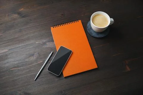 Smartphone, notepad, coffee cup, pen Stock Photos