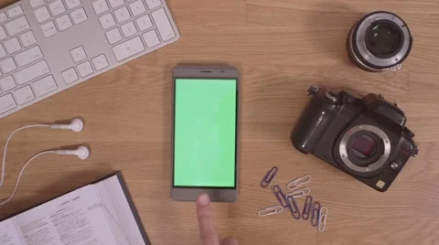 Smartphone on oak table Stock Footage 63391917