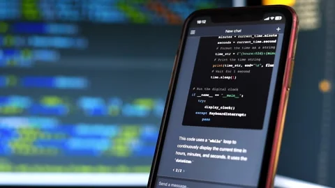 A smartphone with opened AI chat in it. User asking chat bot to write code in Stock Footage 241404775