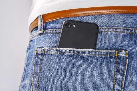 Smartphone in pants pocket Stock Photos
