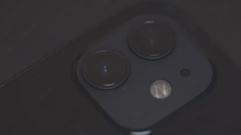 Smartphone photography concept. Closeup on camera lenses with light that passes Stock Footage 240646945