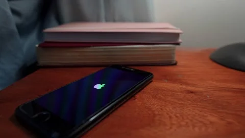 Smartphone powers on and shows lock screen with numeric keypad for passcode Video stock 204839825