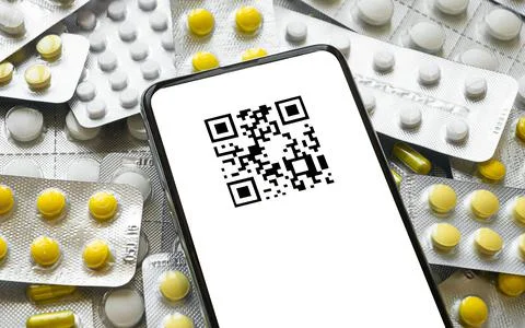 Smartphone with qr code on the background of tablets Stock Photos