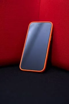 Smartphone on Red Background - Modern Technology Concept Stock Photos