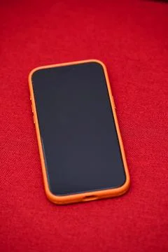 Smartphone on Red Background - Modern Technology Stock Photos
