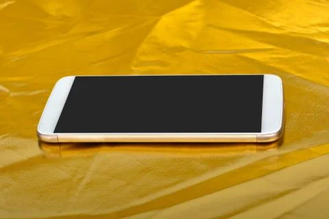 Smartphone Reflection on Golden Background 写真素材