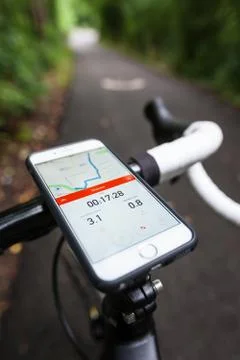Smartphone Running Strava App on a Road Bike Stock Photos