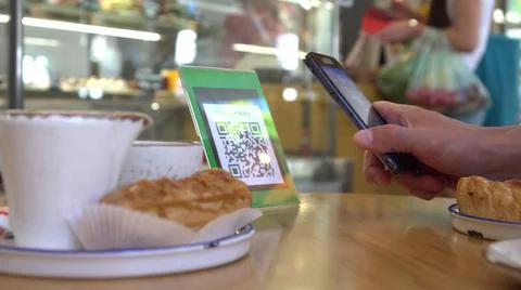 Smartphone scanning the recipients QR code. Mobile banking. Customers can pay Stock-Fotos