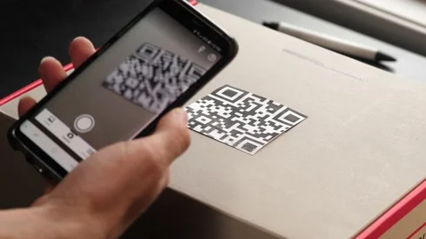 Smartphone Scans Qr Code On A Shipping B 