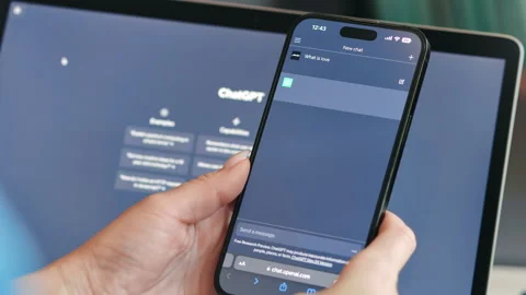 Smartphone screen with ChatGPT virtual chatbot robot OpenAI female hands making Stock Footage 243831483