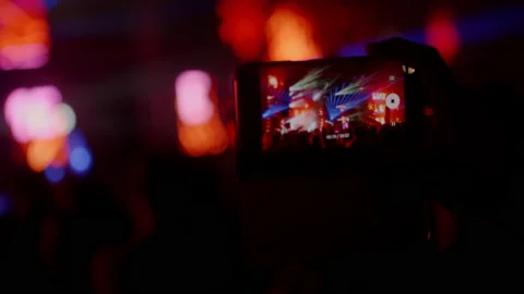 Smartphone screen close-up filming stage at a music festival or a concert 4K. Stock Footage 221555804
