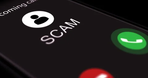 Smartphone screen with incoming call marked as Scam, phone call from scammer Stock Footage 281227183