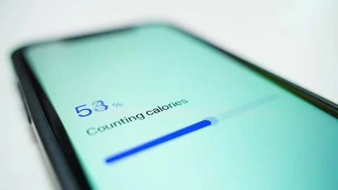 Smartphone screen showing calorie counting progress and food not recognized Stock Footage 342130124