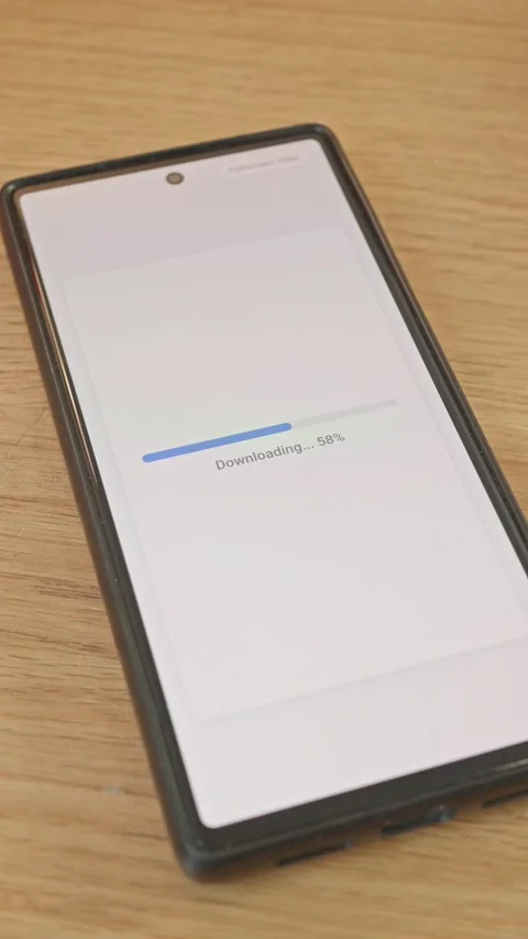 Smartphone screen showing file downloading progress bar and download completed Stock Footage 341860562