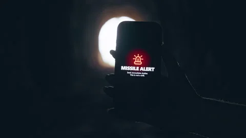 Smartphone Screen Showing Missile Attack Alert Inside Dark Tunnel With Bright Li Stock Footage 335203216