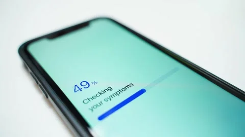 Smartphone screen showing symptom checker progress and assessment error close-up Stock-Footage 341078444