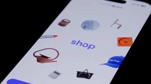 Smartphone screen as user taps shopping app icon. Mobile commerce, touchscreen Stock Footage 333928523
