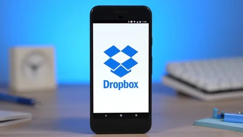 Smartphone Showing Dropbox Cloud Storage App Logo on Display Stock Footage 88736482