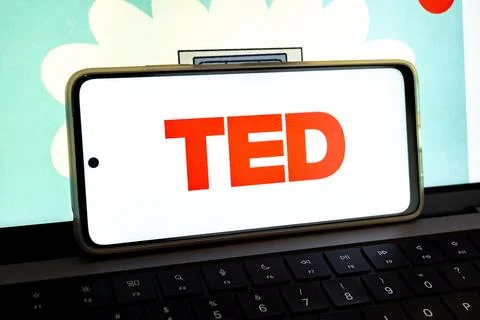 Smartphone showing ted logo on computer keyboard Stock Photos
