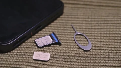 Smartphone SIM Card Replacement with Ejector Pins and Tray Vídeos de archivo 344955300