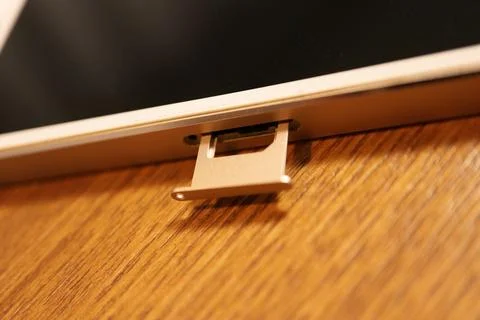 Smartphone SIM card tray ejected for chip replacement or installation close.. Stock Photos