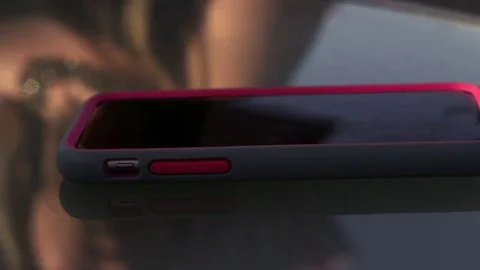 Smartphone sitting on table in landscape mode Stock Footage 77620918