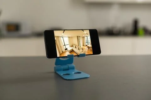 Smartphone in a stand with design Stock Photos