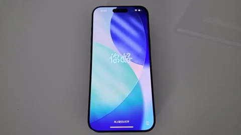Smartphone Standing Upright Displaying Bright Screen Stock Footage 327545500
